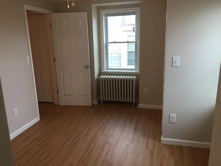 Standing from the bathroom looking into the bedroom
