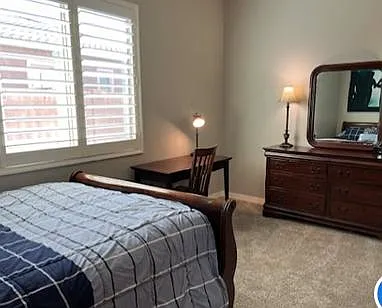Bedroom 1 with queen size bed, nightstand, desk, dresser w/mirror, walk in closet and full length mirror