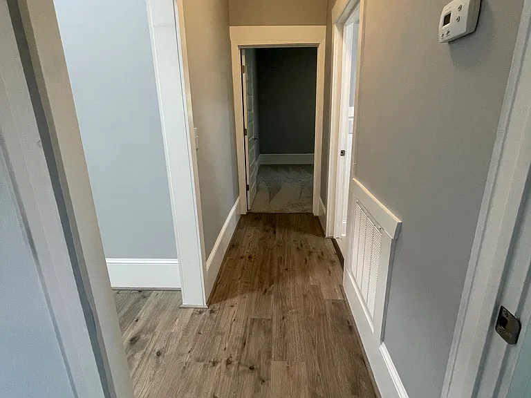 Hallway to bathroom and 2 bedrooms