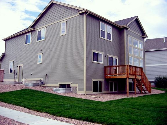 rear yard is now fenced; old deck shown, photos of the new one follow. And, there's a new wood privacy fence.