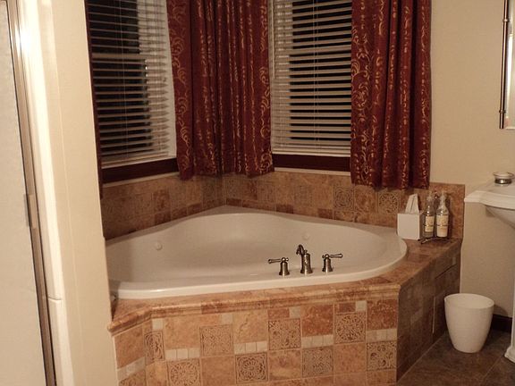 Tiled Whirlpool Jetted Bath with Separate Shower