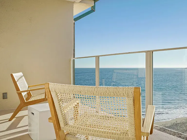 Step onto the balcony and take in the breathtaking sights of Malibu's coastline.
