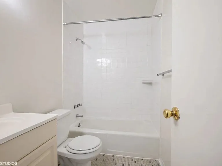 Bright white bathroom with full tub