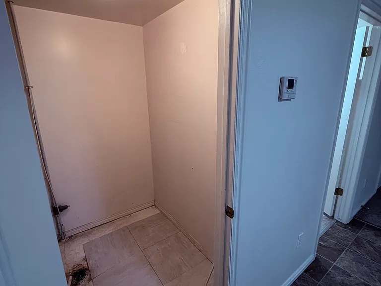 Furnace closet, opens off the dining area