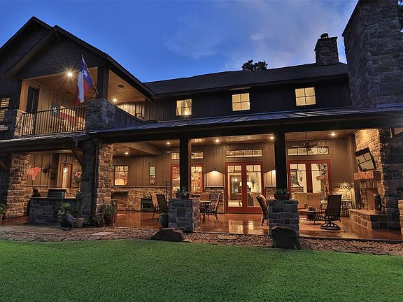 ENJOY QUIET EVENINGS ON THE HUGE COVERED PATIO WITH OUTDOOR KITCHEN AND LIVING AREA WITH FIREPLACE!