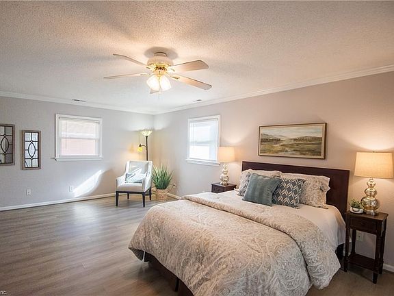 primary bedroom with ensuite and walk in closet 