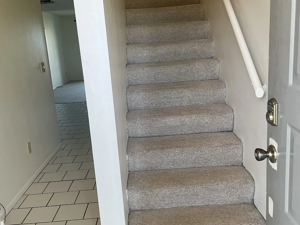 FOYER, STAIR & CORRIDOR TO DINING, HALF BATH, LIVING & BALCONY