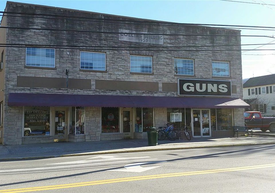 The Collins Building with shop fronts on Main Street, WSS. B