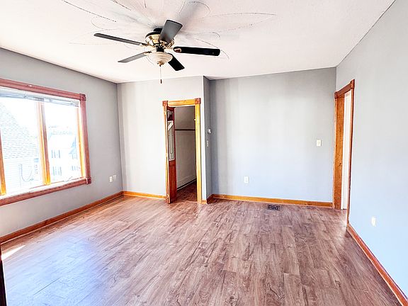 Spacious living room with big walk-in storage space.