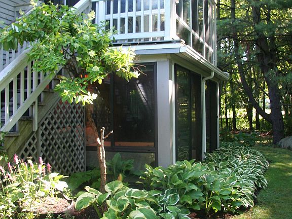 Outside view of the Forida sun/bedroom from backyard. A new 11'x9' outside deck with lounge chairs and tea table has been added, accessible from the bedroom or outside stairs. See next photo!