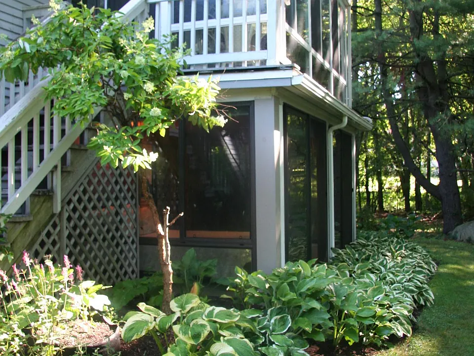 Outside view of the Forida sun/bedroom from backyard. A new 11'x9' outside deck with lounge chairs and tea table has been added, accessible from the bedroom or outside stairs. See next photo!