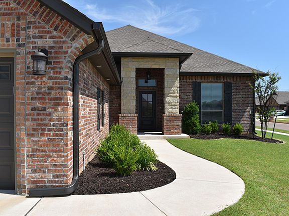 Gorgeous and welcoming entryway. Curb appeal galore! And home sits on a large, corner lot, so neighbors only on one side.