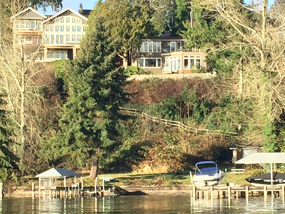 Large beach area with dock & boat lift.