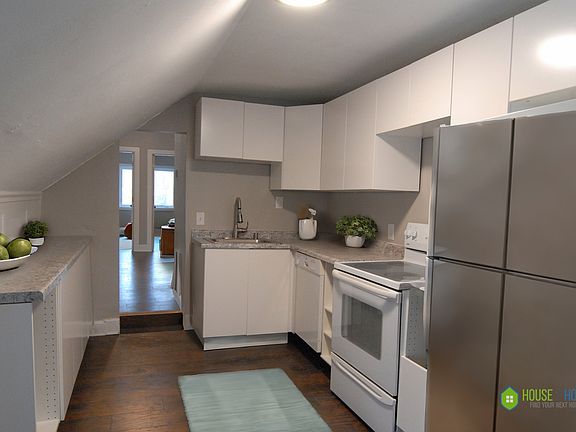 Eat-in Kitchen with dishwasher, refrigerator, and range. Vent hood and microwave to be installed.