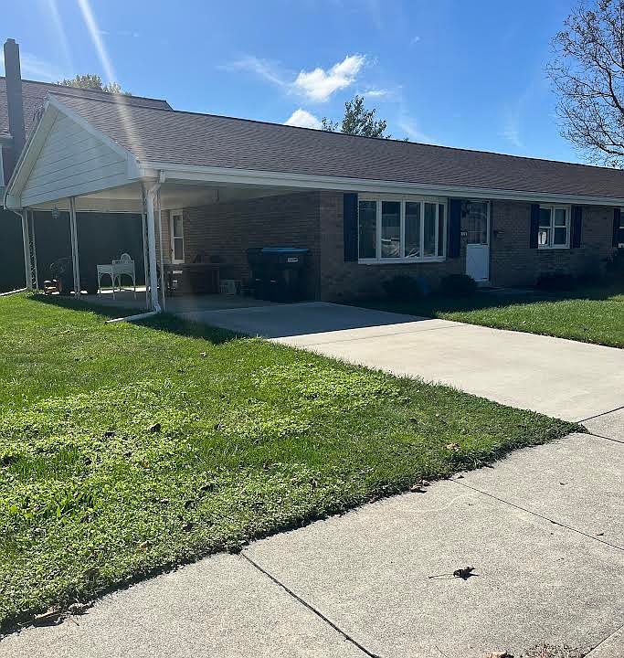 Front View with driveway and carport/covered patio