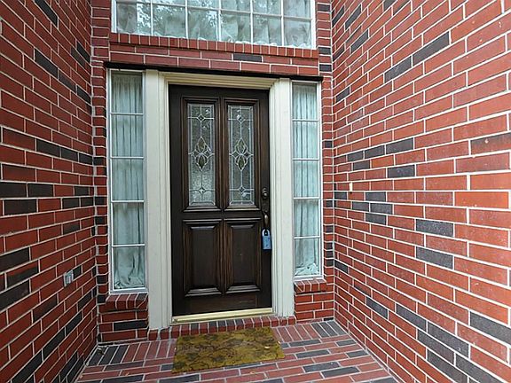 Front patio with upgrade glass door.