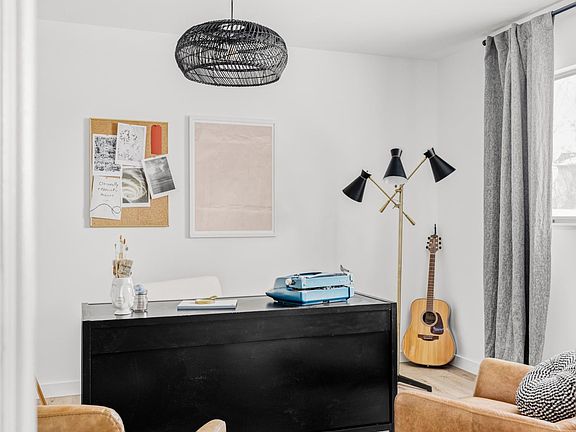 Main floor bedroom (styled as office) Includes large walk in closet