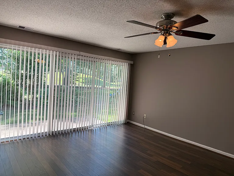 Large sliding glass door overlooks the fairway
