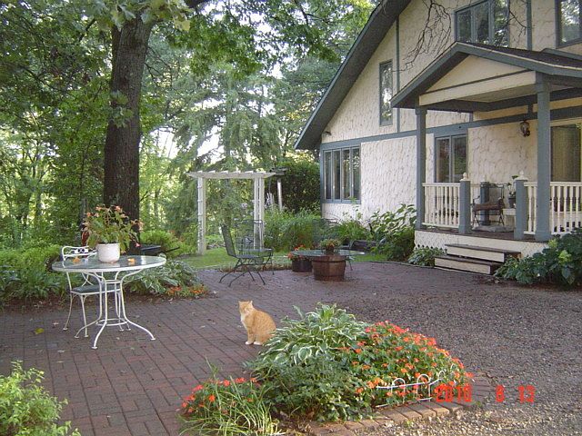 The patio between the garage and the front door