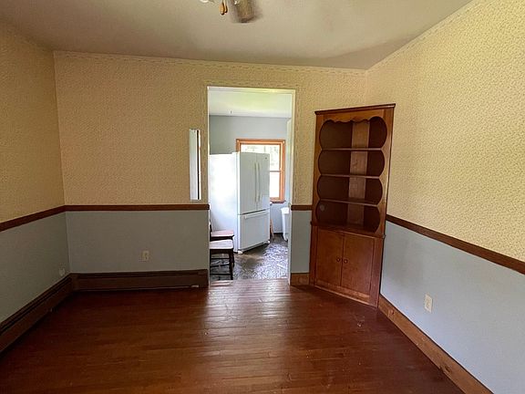 Traditional dining room with hardwood flooring