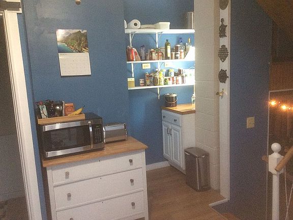 Kitchen with large pantry.