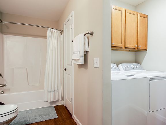 Separate laundry area off of the guest bathroom