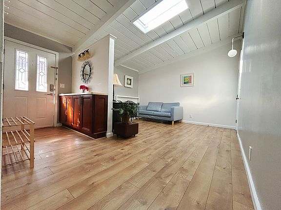 Living area and front entrance with skylight