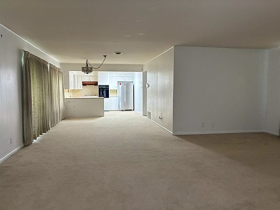 view from living room/dining room to kitchen