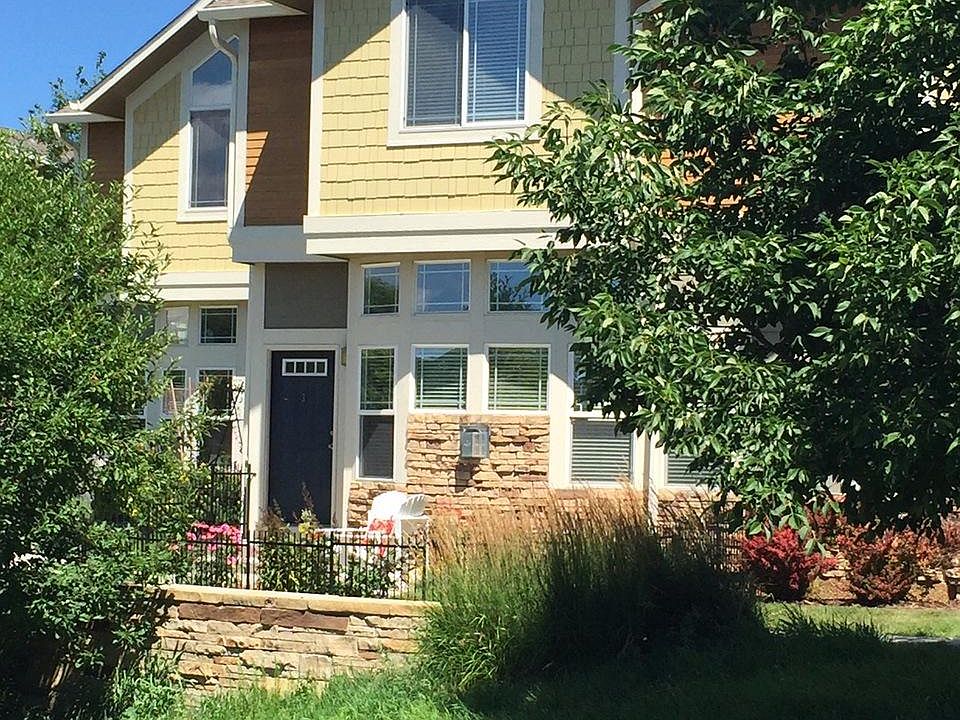 Two-story townhome with full basement, 2-car garage, patio.