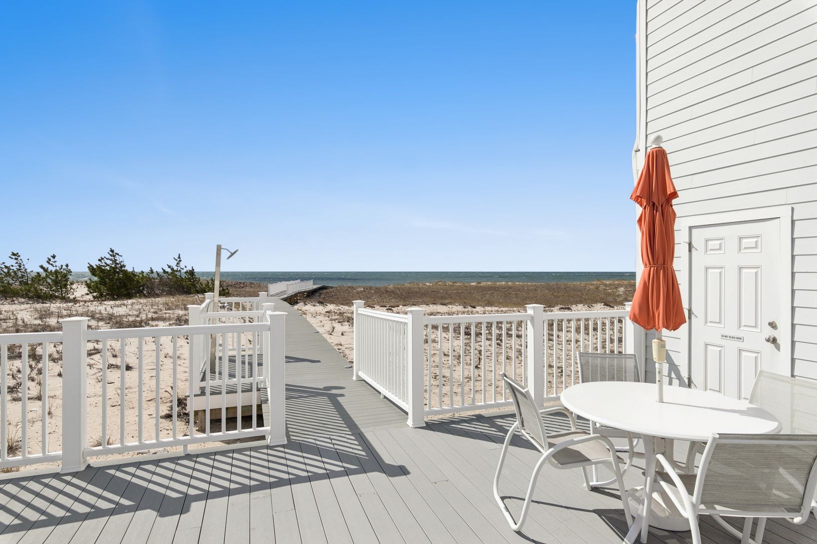 The Sandpiper's outdoor seating, shower and beach access.