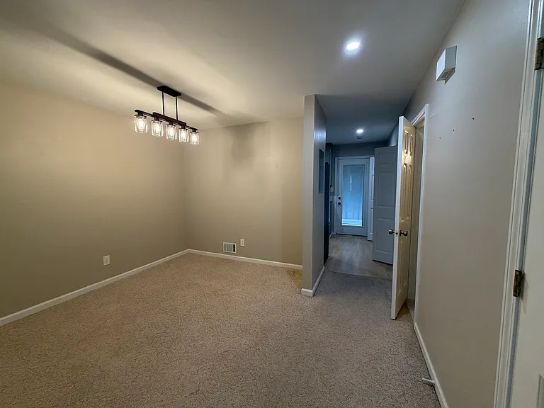 Dining room with a door to the 1/2 bathroom