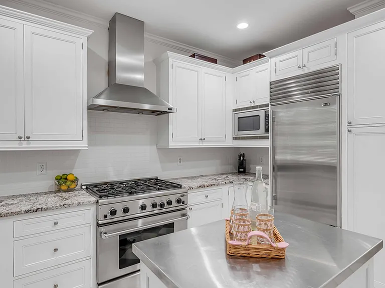 Kitchen with Subzero Fridge and gourmet DCS gas range.