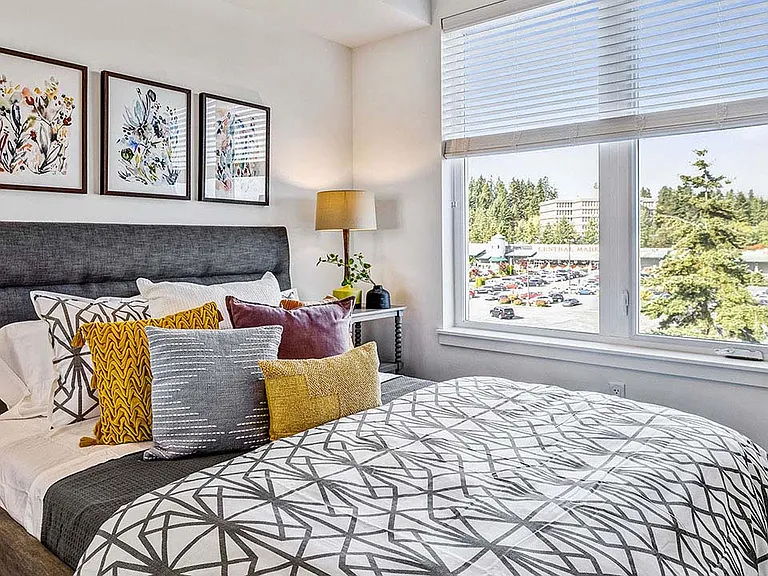 Griffis Shoreline apartment bedroom with large window.