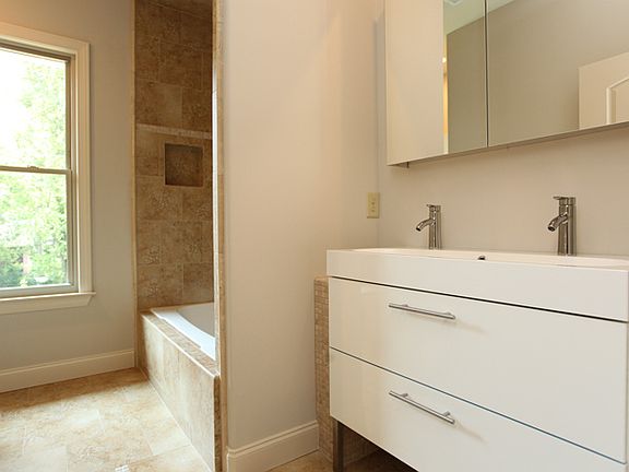 Gracious hall bath with plenty of natural light