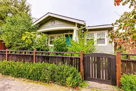 Street view from Madison St. Hedges are currently grown much taller, shading the porch from view.