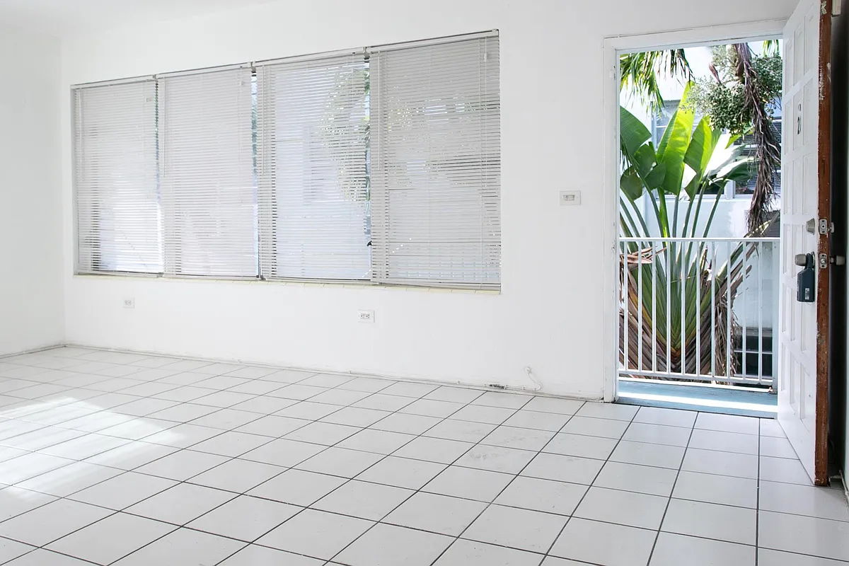 Huge living room with surround impact windows 
Great for quiet, privacy, security and storm protection. No one is around you private corner with large rooftop balcony. - Collins Ave