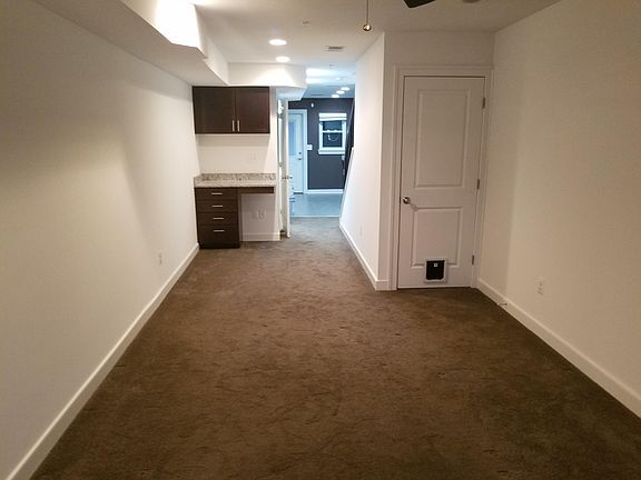 Living room, bar, and stairs storage closet