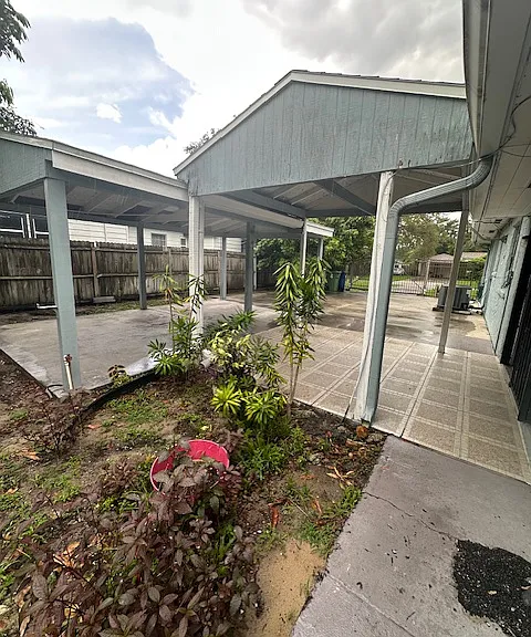 Attached car port to back door.