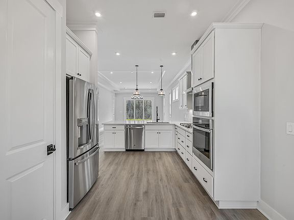 French door refrigerator, cooktop, oven, microwave and dishwasher