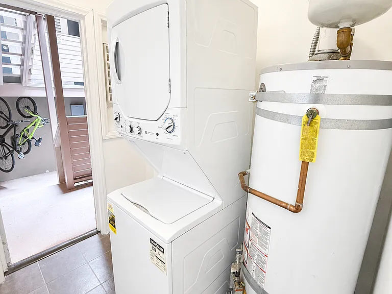 washroom, backdoor open leading to outdoor storage