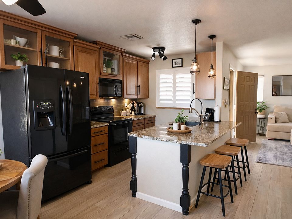 FULL KITCHEN WITH FULL SIZE REFRIGERATOR WITH ICE MAKER AND WATER, REVERSE OSMOSIS AT THE SINK, BRAND NEW RANGE, DISHWASHER , AND MICROWAVE.