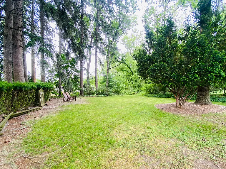 Discover a hidden gem in the backyard beyond the gate_a secret garden that transports you to another world. This tranquil bonus space is perfect for immersing yourself in a novel while surrounded by lush greenery and the soothing sounds of nature.