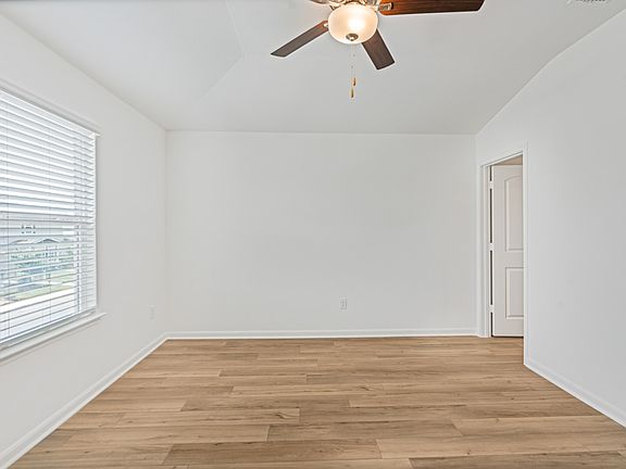 Master bedroom with large windows and enough space for all of your king-size furniture.