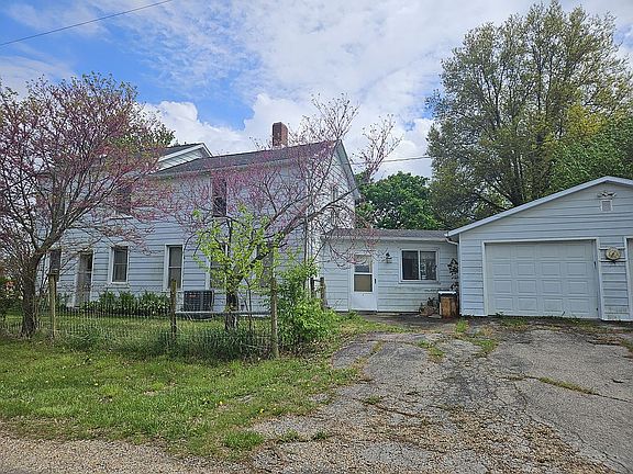 home, breezeway, a garage