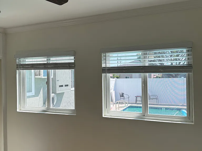 Bedroom with view of swimming pool