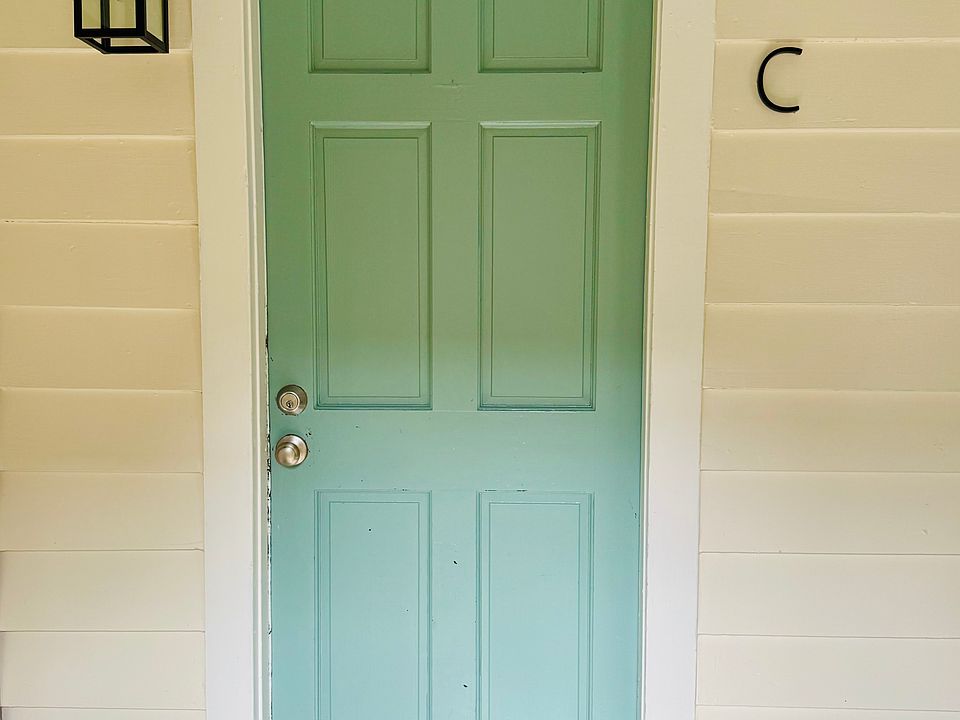 Apt C is on the ground floor of this "Charleston Single" style house. It's down the brick alley on the side of the house.