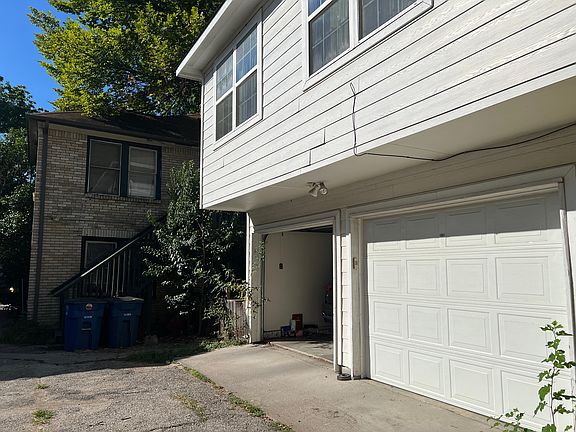 6015 Ross Avenue 1 car new garage with a window & storage!