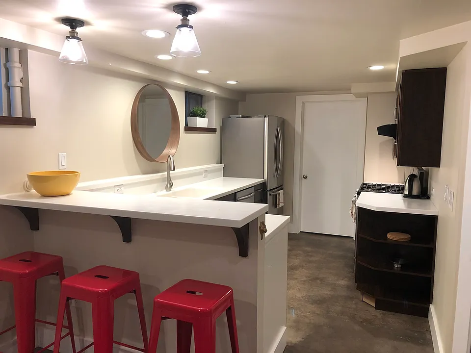 open kitchen with gas range, dishwasher, fridge with ice maker