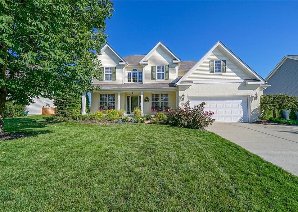 Classic painted brick and multiple peaks add architectural interest.