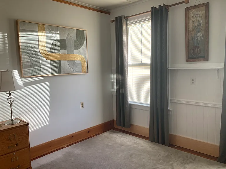 2-large Western sunny windows flood the Bdrm with warmth during the mid day to late afternoon winter months when panel drapes are open. Closing the panels at night and during the summer warm days keeps out the heat.